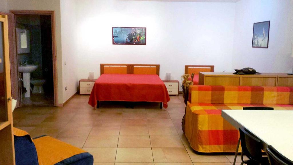 A bed or beds in a room at Verdeblu Country Hotel