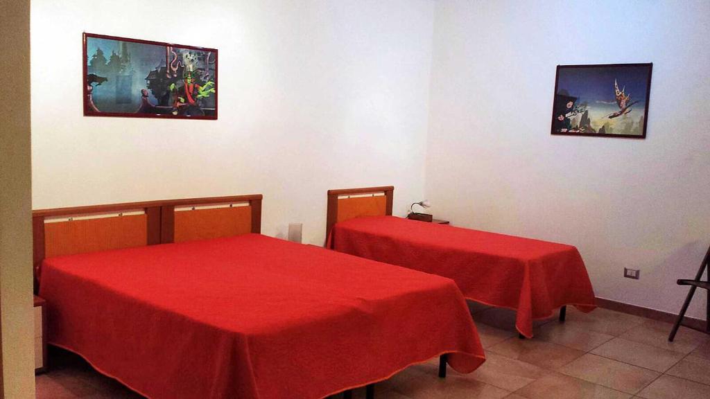 A bed or beds in a room at Verdeblu Country Hotel
