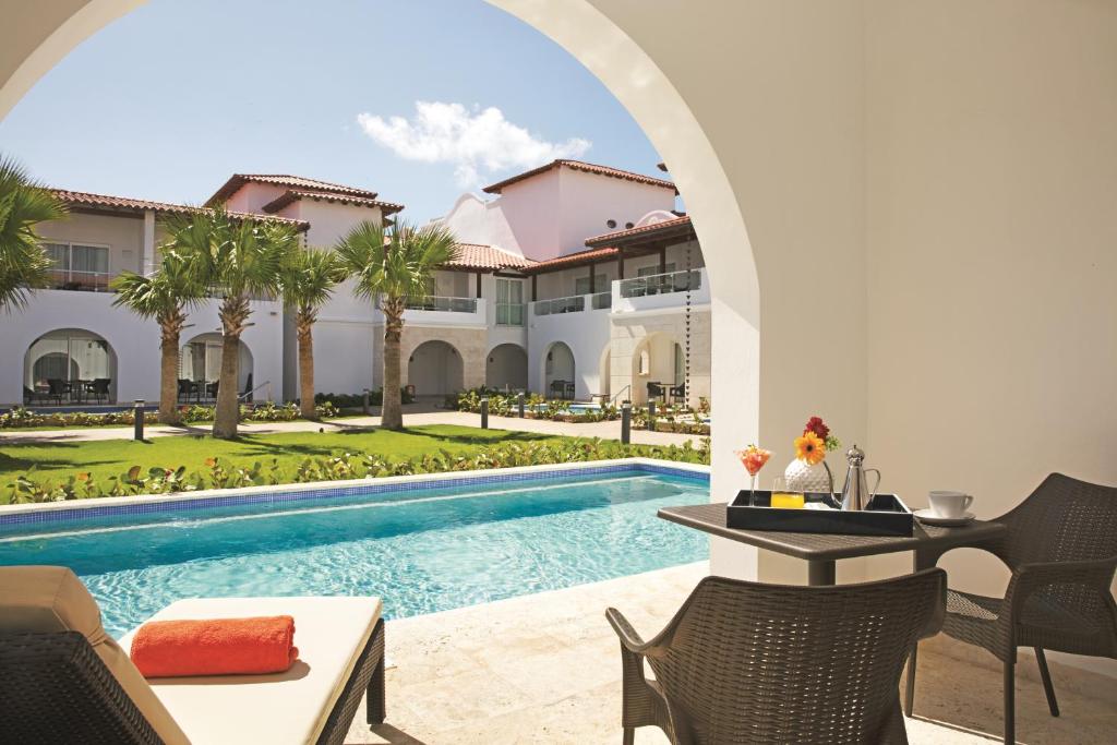 a view of a villa with a swimming pool at Dreams Dominicus La Romana Resort & Spa in Bayahibe