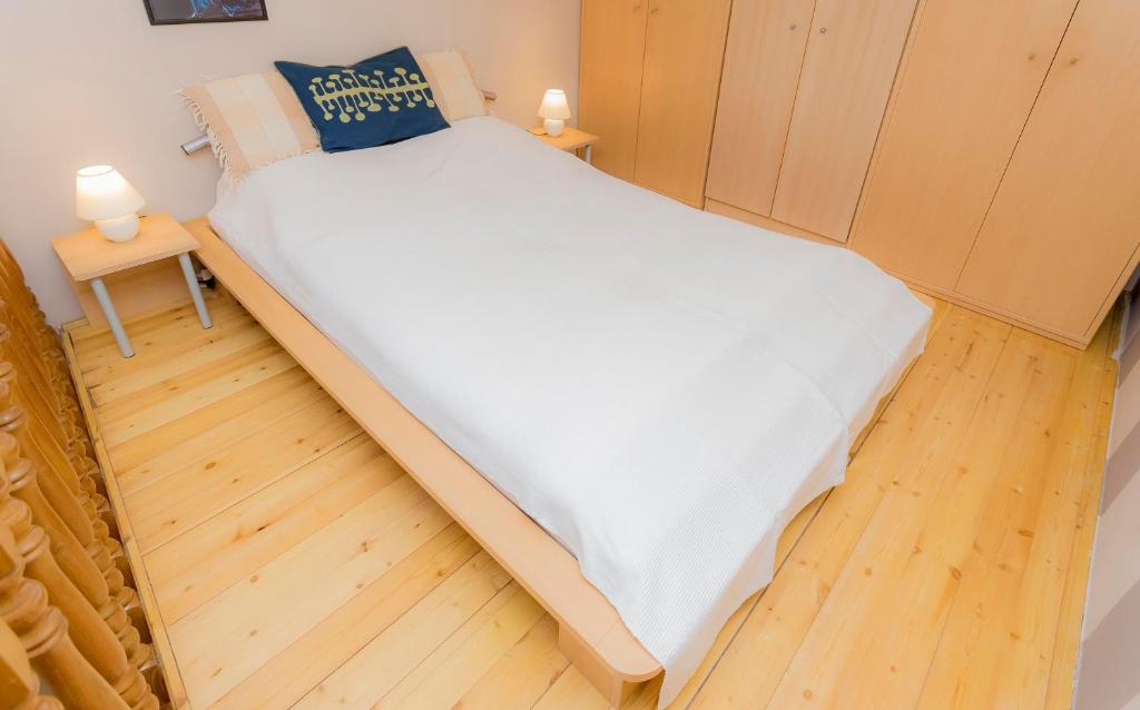 A bed or beds in a room at Souper Apartments Downtown-Király Street