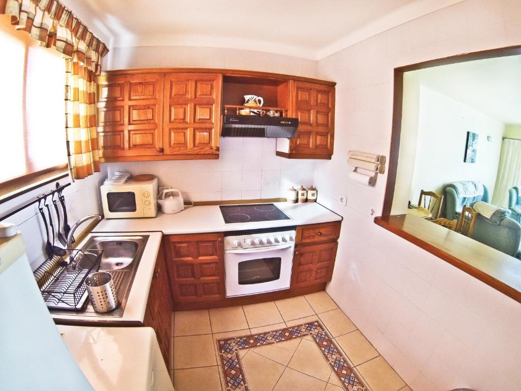 Kuchyň nebo kuchyňský kout v ubytování Apartment Paraiso Royal