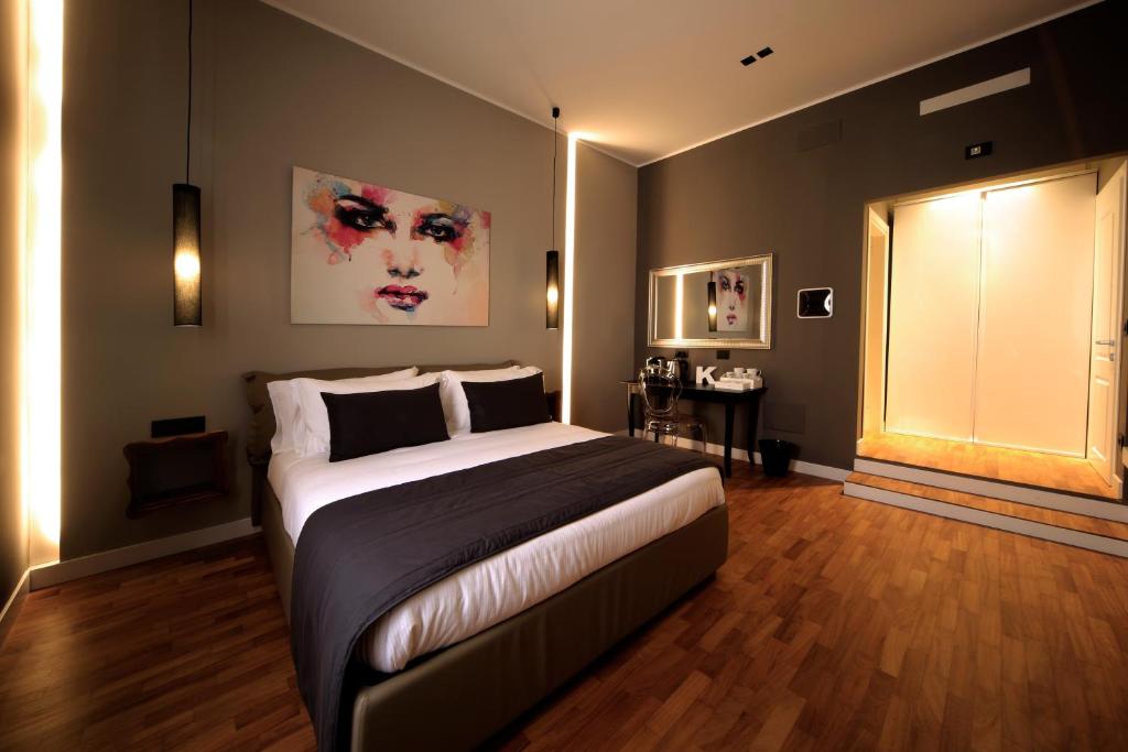 Postel nebo postele na pokoji v ubytování K Rooms