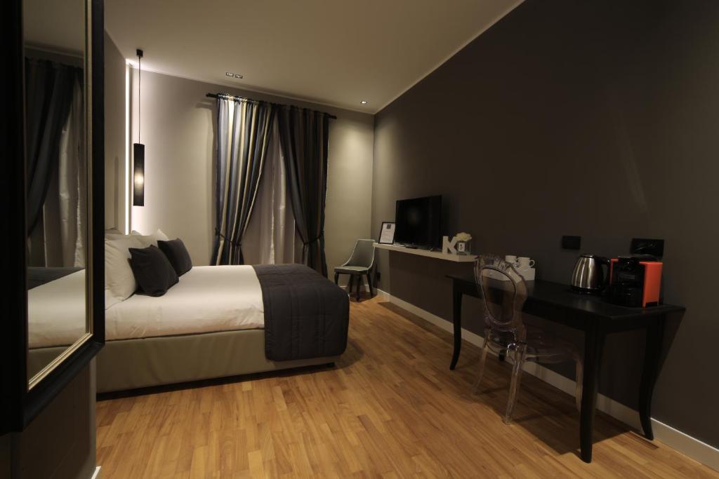 Postel nebo postele na pokoji v ubytování K Rooms