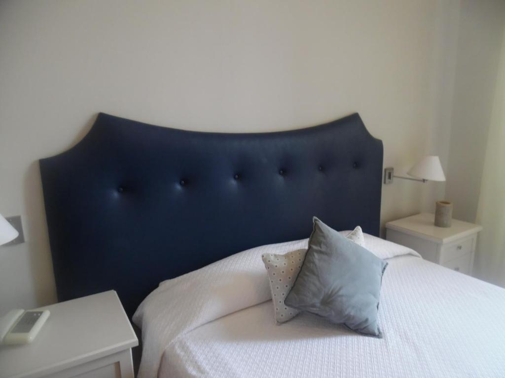 Postel nebo postele na pokoji v ubytování Hotel Miramare