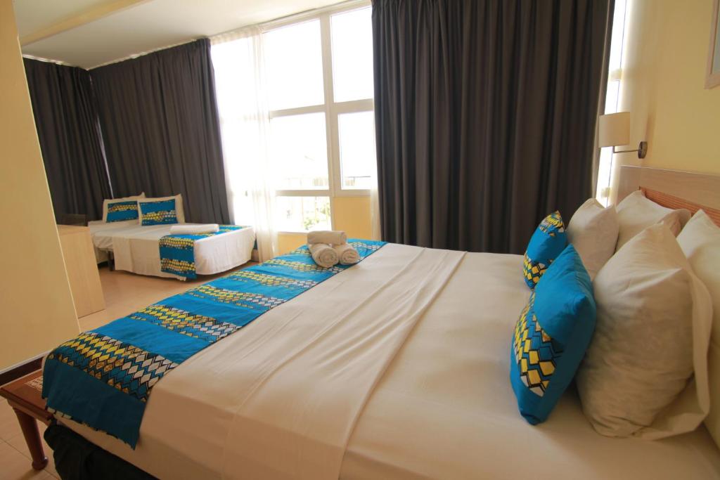 Postel nebo postele na pokoji v ubytování Hotel Santa Maria