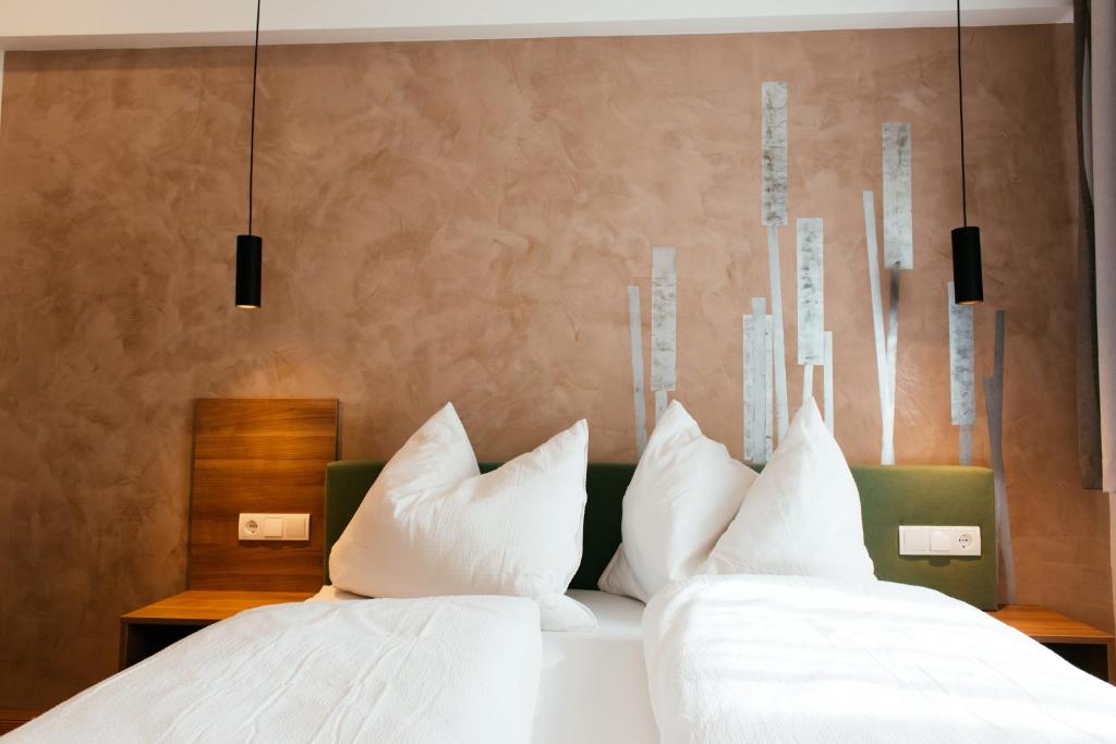 Postel nebo postele na pokoji v ubytování Aparthotel Heuberger