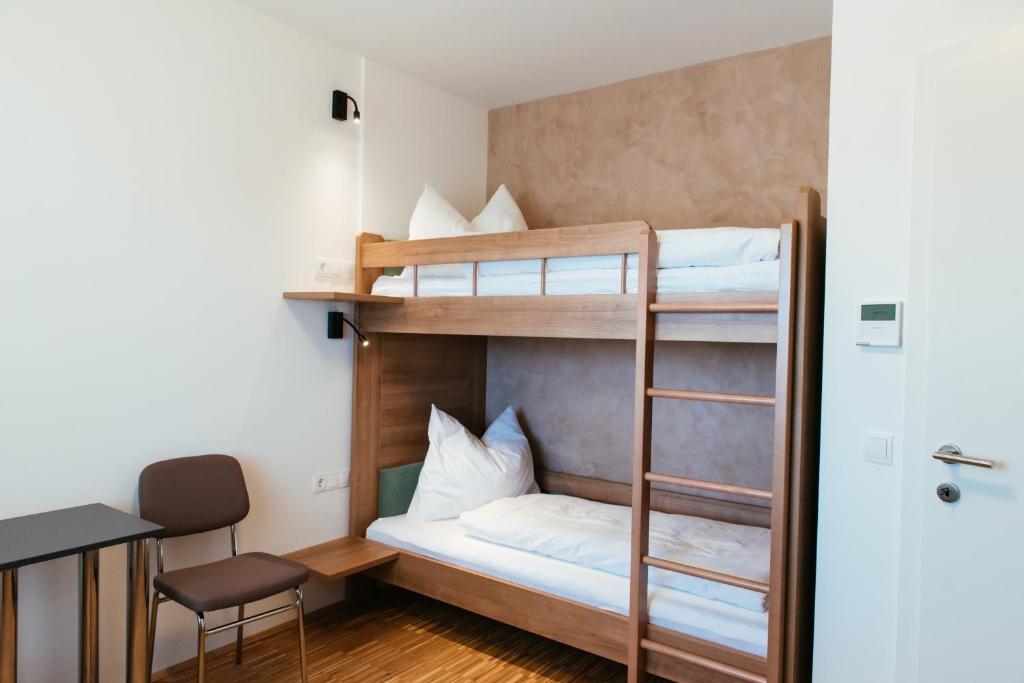 Postel nebo postele na pokoji v ubytování Aparthotel Heuberger