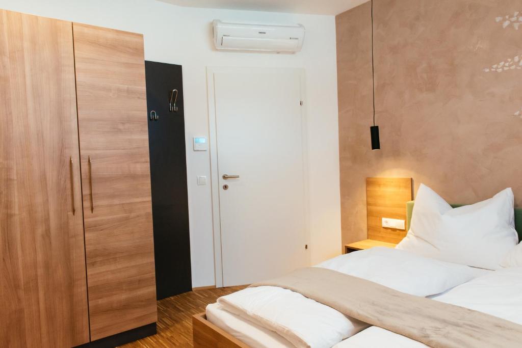 Postel nebo postele na pokoji v ubytování Aparthotel Heuberger