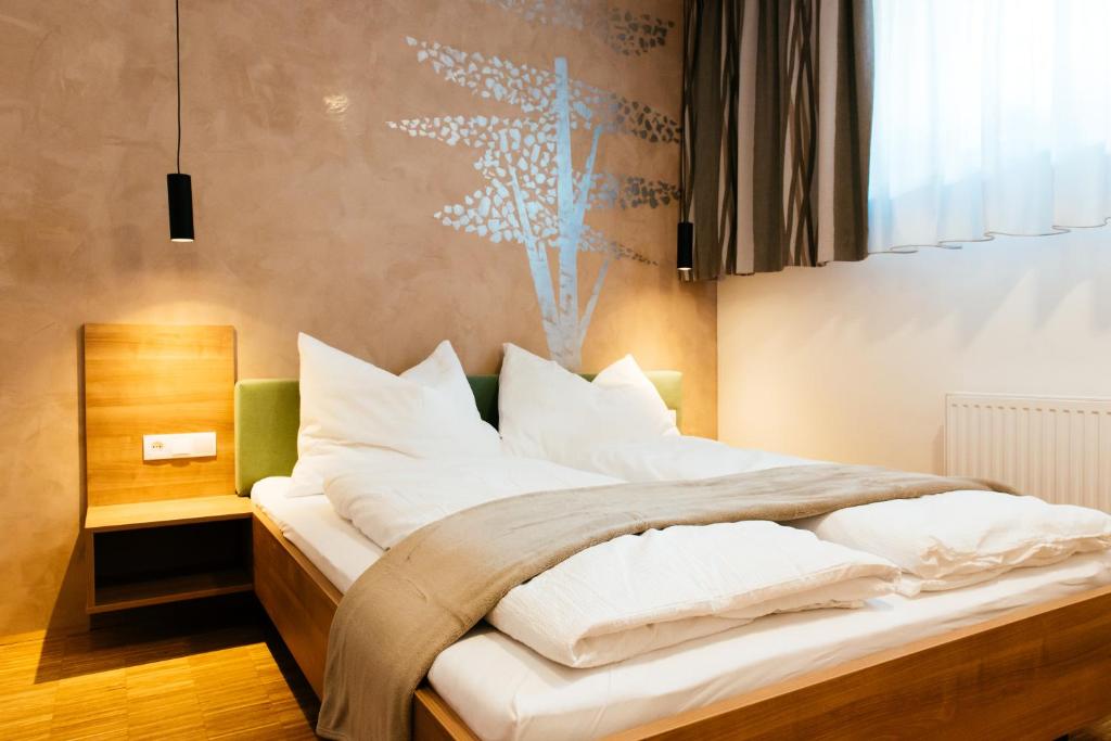 Postel nebo postele na pokoji v ubytování Aparthotel Heuberger
