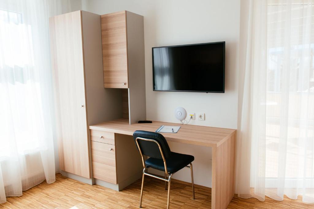 TV a/nebo společenská místnost v ubytování Aparthotel Heuberger