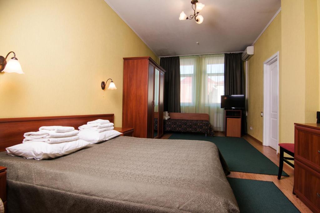 Postel nebo postele na pokoji v ubytování Mini-hotel on Geroiv Energetykiv Street 18