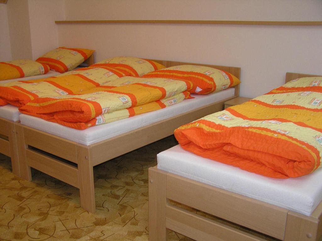Postel nebo postele na pokoji v ubytování Penzion U Tomášů