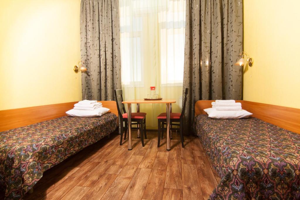 Postel nebo postele na pokoji v ubytování Mini-hotel on Geroiv Energetykiv Street 18