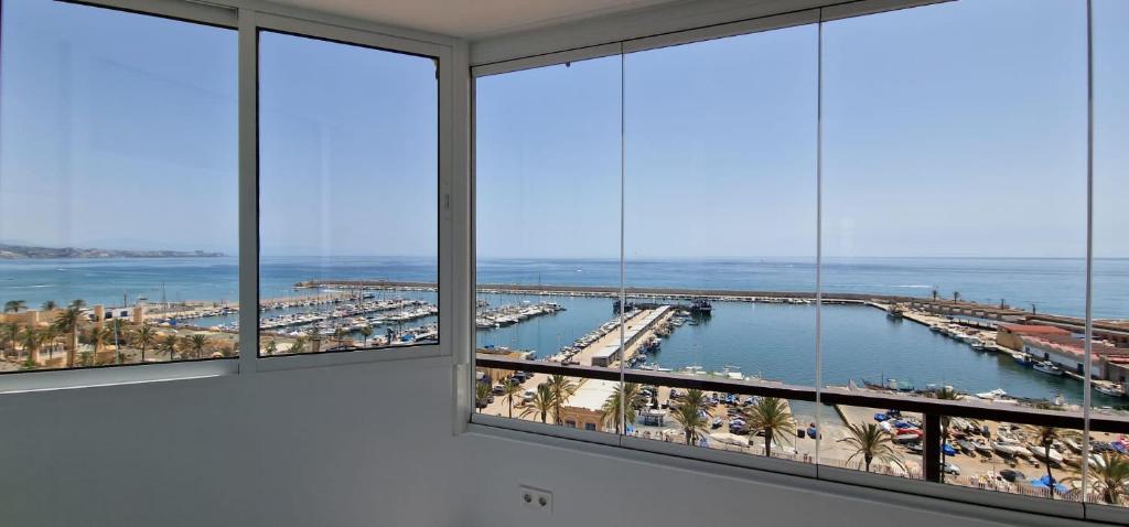 Las Palmeras - Seafront Apartment for 6 with Glazed Terrace and Marina Views