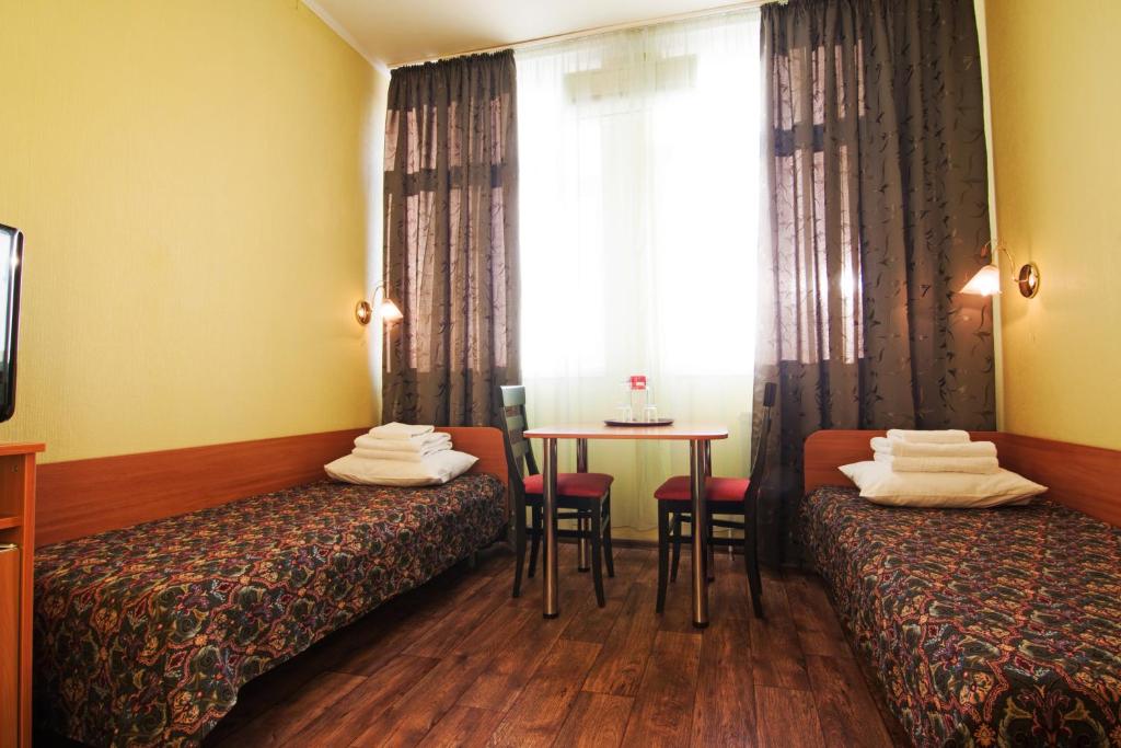 Postel nebo postele na pokoji v ubytování Mini-hotel on Geroiv Energetykiv Street 18