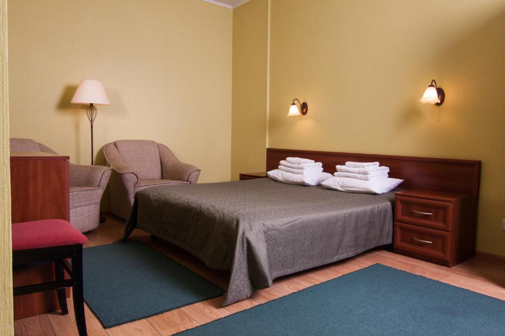 Postel nebo postele na pokoji v ubytování Mini-hotel on Elektrotechnichnaya Street 18