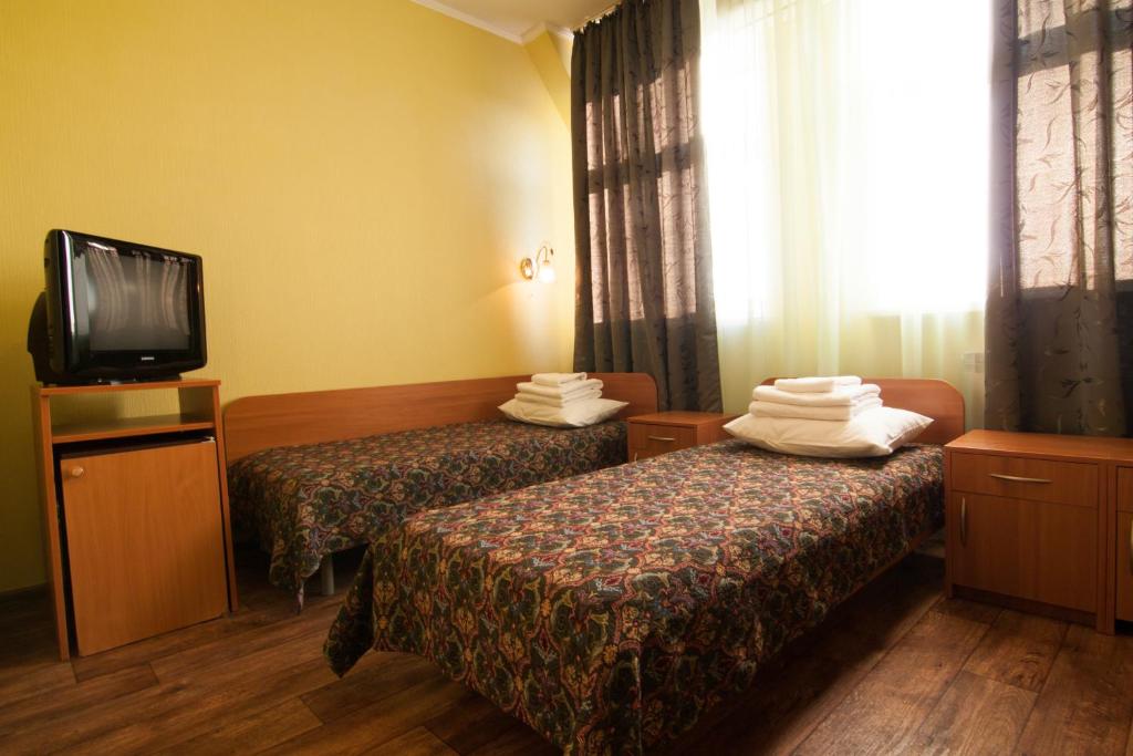 Postel nebo postele na pokoji v ubytování Mini-hotel on Geroiv Energetykiv Street 18