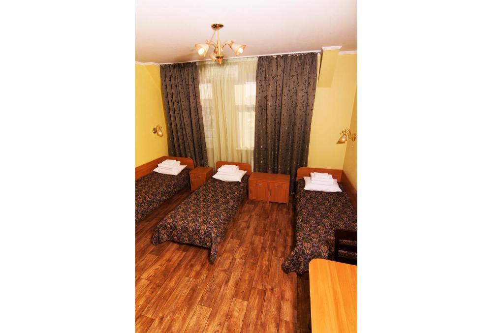 Postel nebo postele na pokoji v ubytování Mini-hotel on Geroiv Energetykiv Street 18