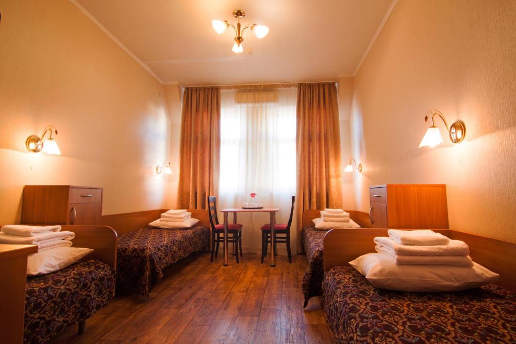 Postel nebo postele na pokoji v ubytování Mini-hotel on Geroiv Energetykiv Street 18