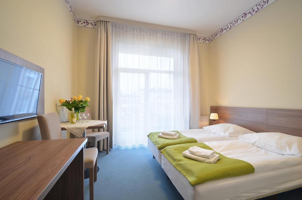 Postel nebo postele na pokoji v ubytování Hotel Zorza