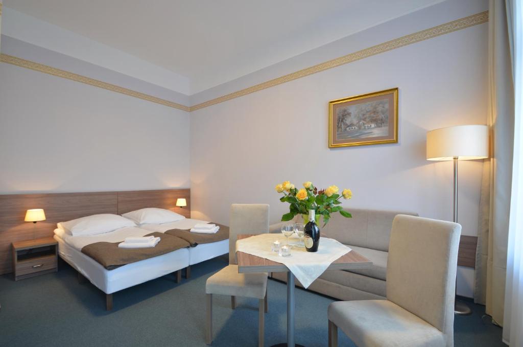 Postel nebo postele na pokoji v ubytování Hotel Zorza