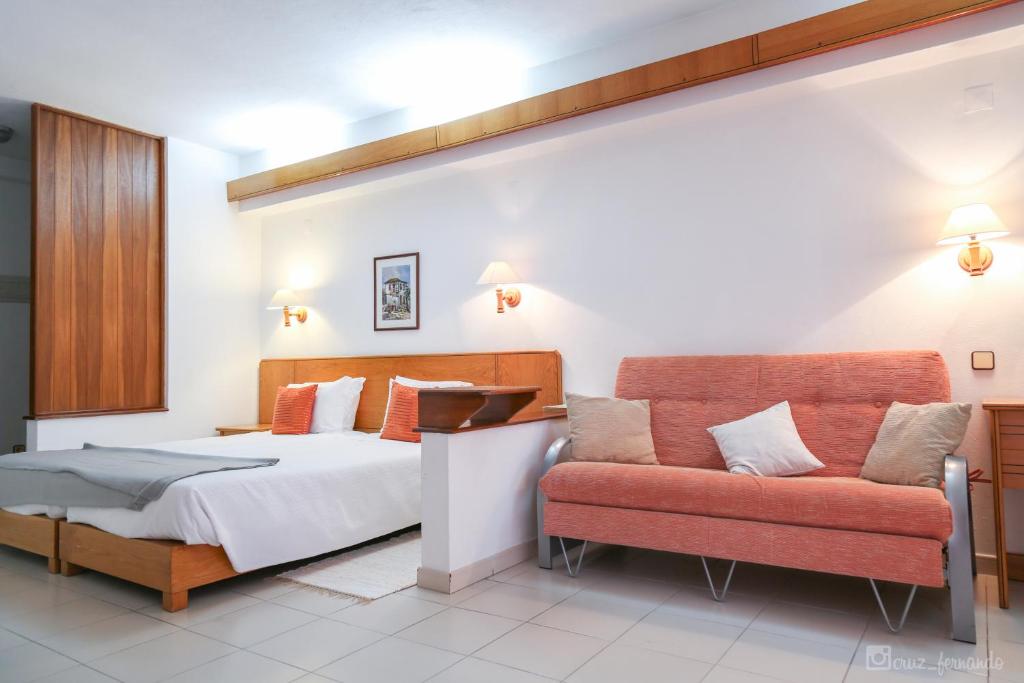 Uma cama ou camas num quarto em Hotel Pantanha Nature & Fitness