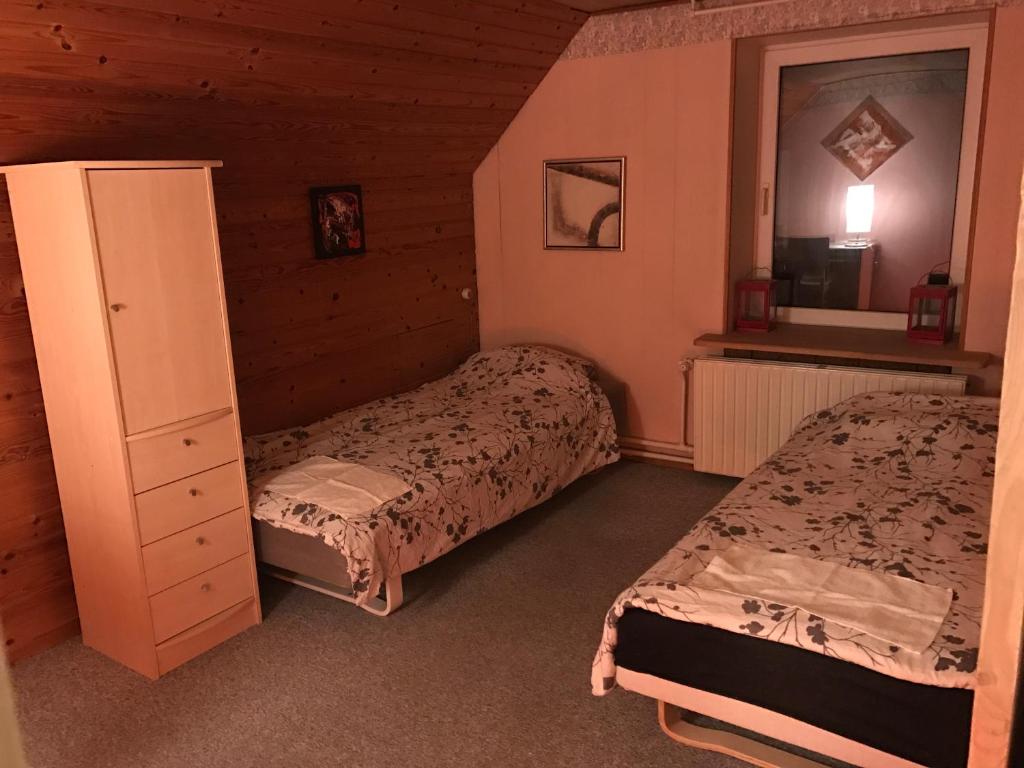 Postel nebo postele na pokoji v ubytování Rundvejen Guest House