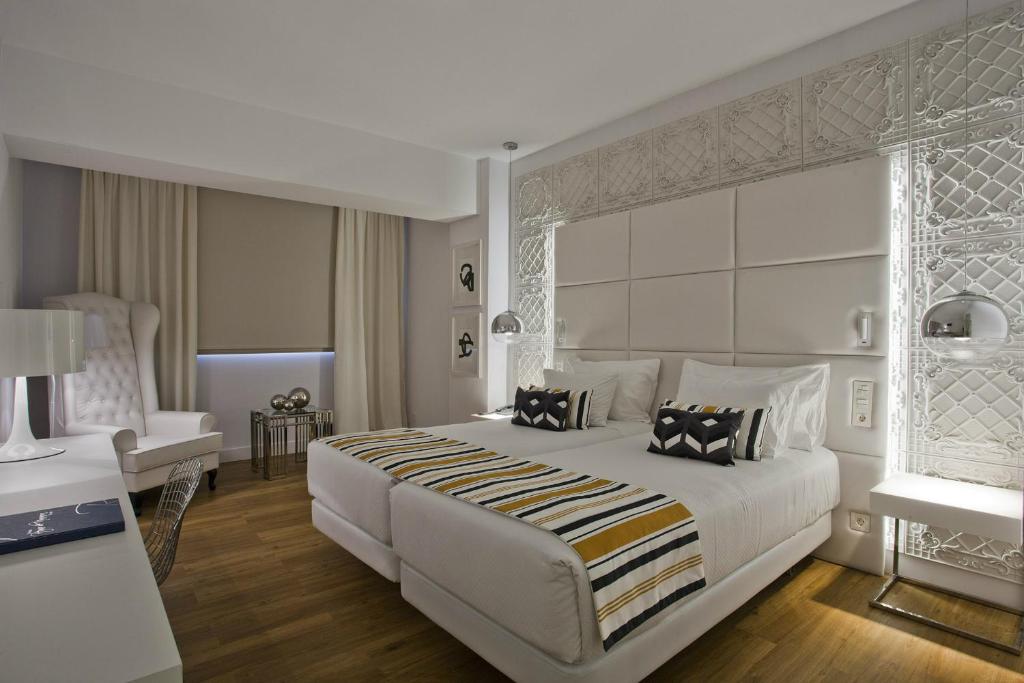 Postel nebo postele na pokoji v ubytování Hotel Tres Reyes Pamplona