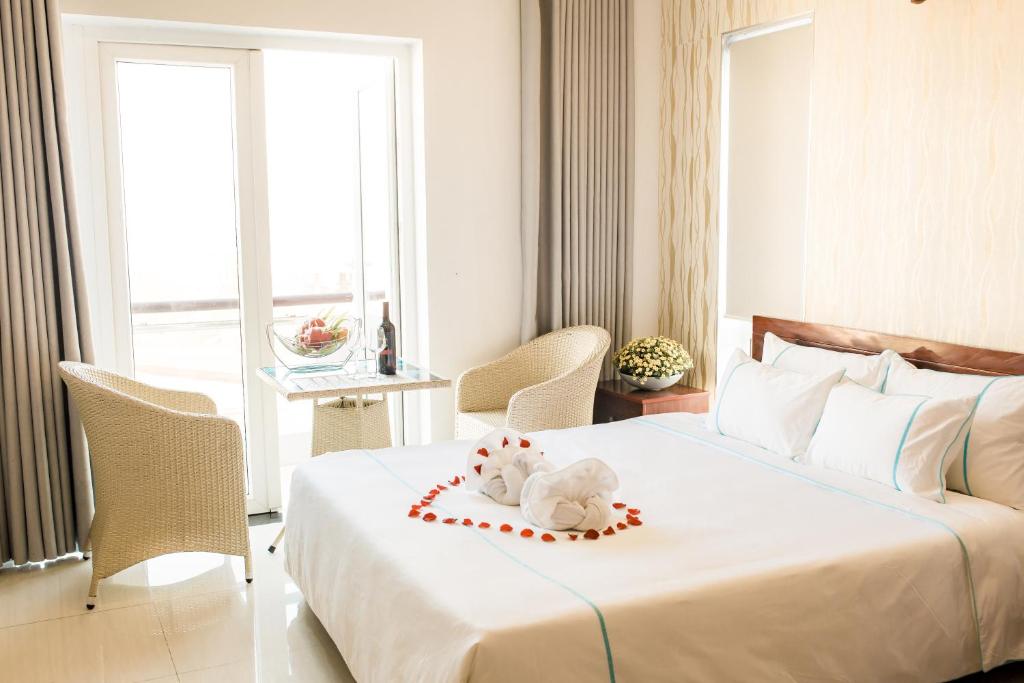 Postel nebo postele na pokoji v ubytování Gio Bien 2 Hotel by THG