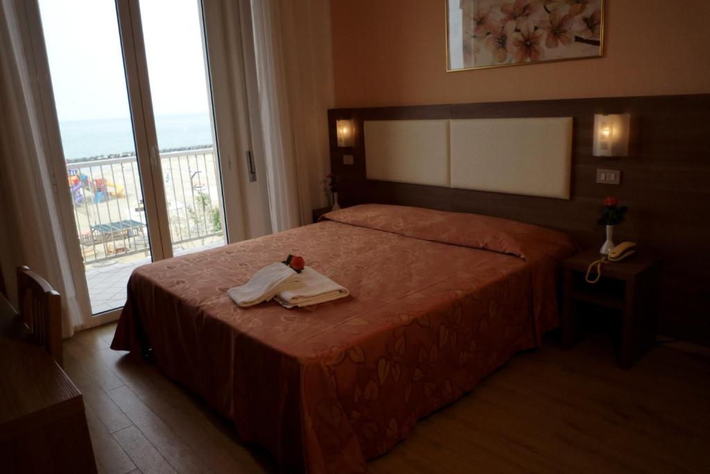 Postel nebo postele na pokoji v ubytování Hotel Sara