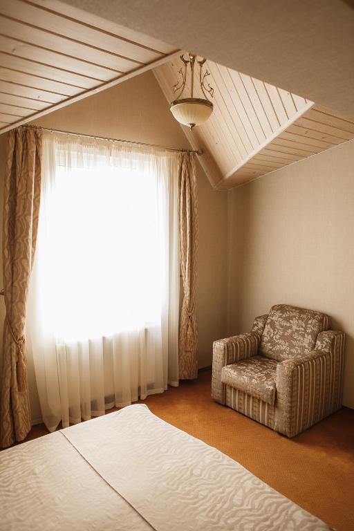 Postel nebo postele na pokoji v ubytování Georg Palace Hotel