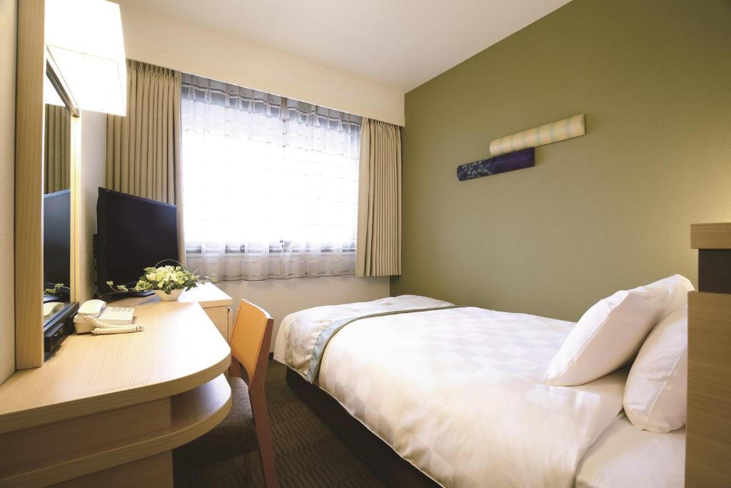 TV a/nebo společenská místnost v ubytování Karasuma Kyoto Hotel