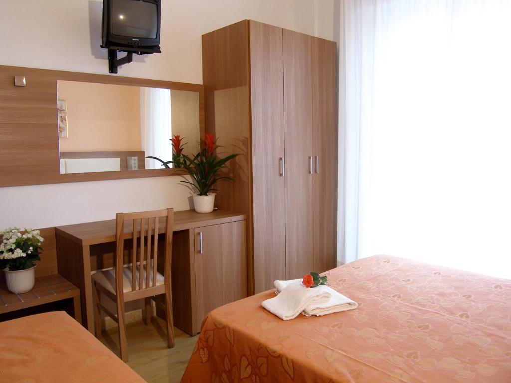 Postel nebo postele na pokoji v ubytování Hotel Sara