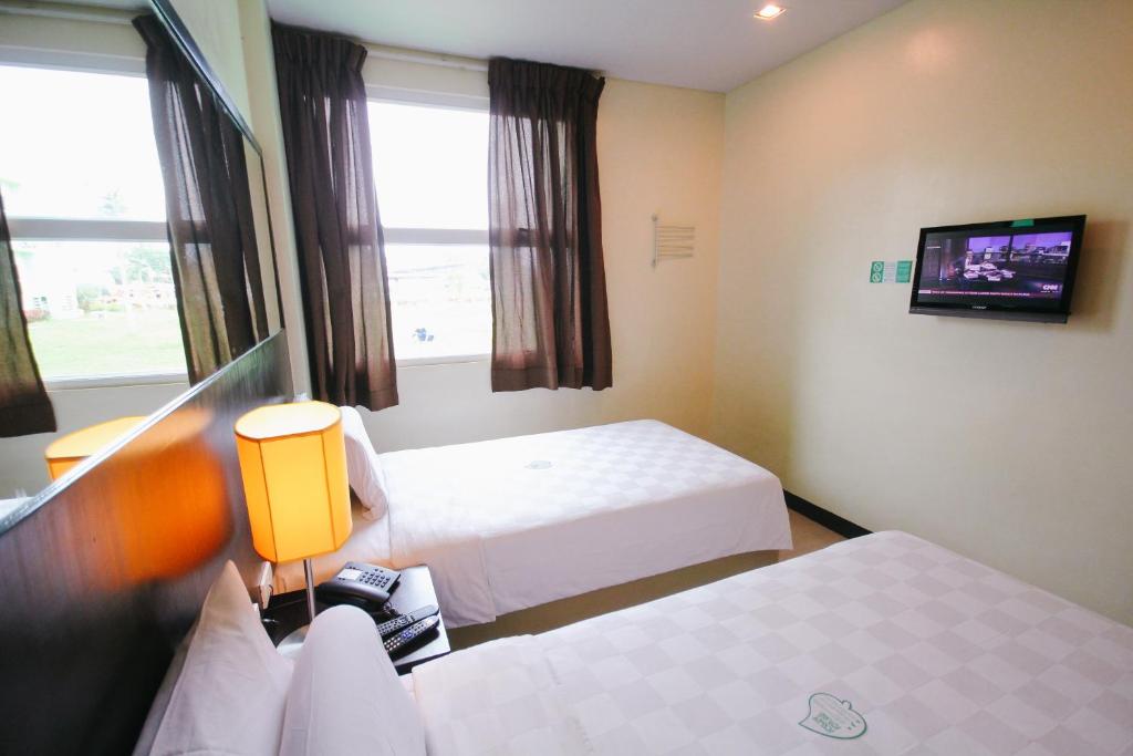 Postel nebo postele na pokoji v ubytování Go Hotels Dumaguete