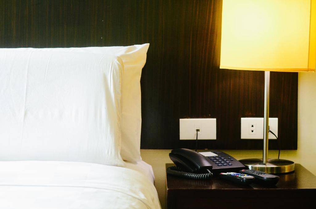 Postel nebo postele na pokoji v ubytování Go Hotels Dumaguete