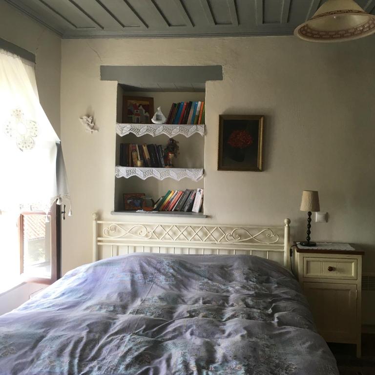 A bed or beds in a room at Charming Stone House