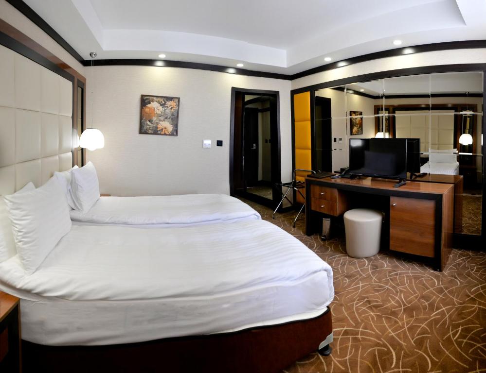 En eller flere senger på et rom på Hotel Cartoon Razgrad
