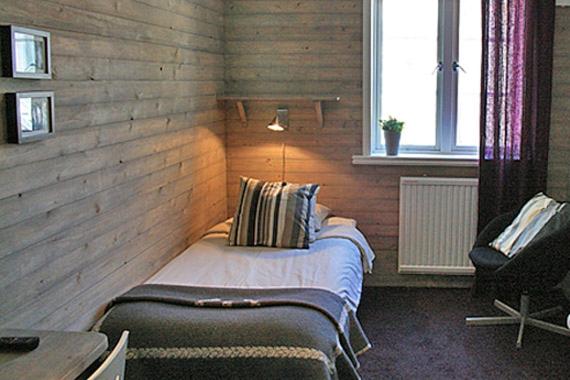 Postel nebo postele na pokoji v ubytování Strandhotellet