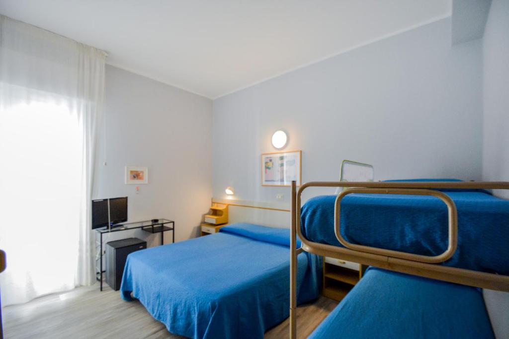 Postel nebo postele na pokoji v ubytování Hotel Mirabella