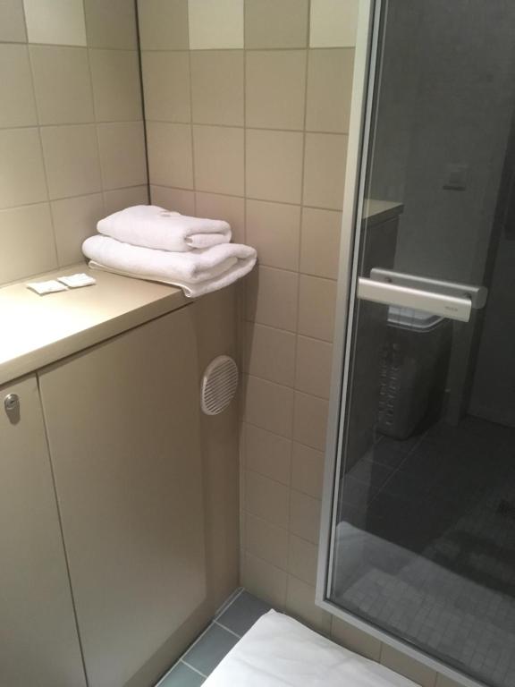 Koupelna v ubytování Hotel Du Commerce