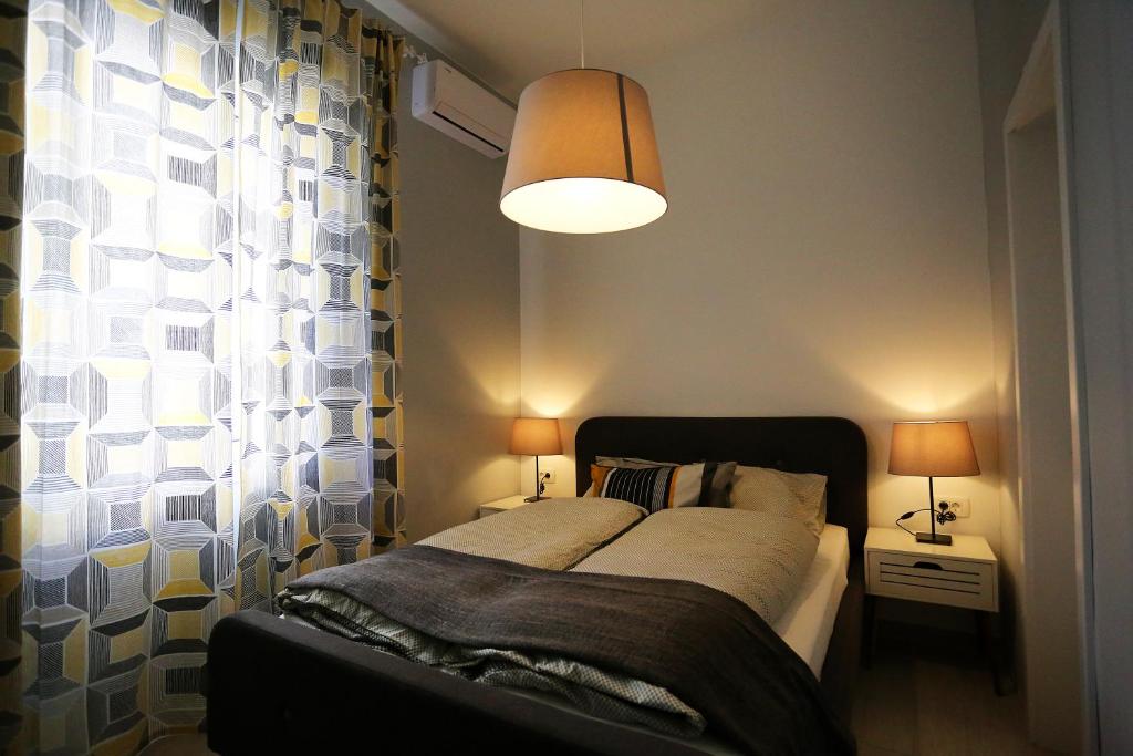 Postel nebo postele na pokoji v ubytování Guesthouse Villa Maggie