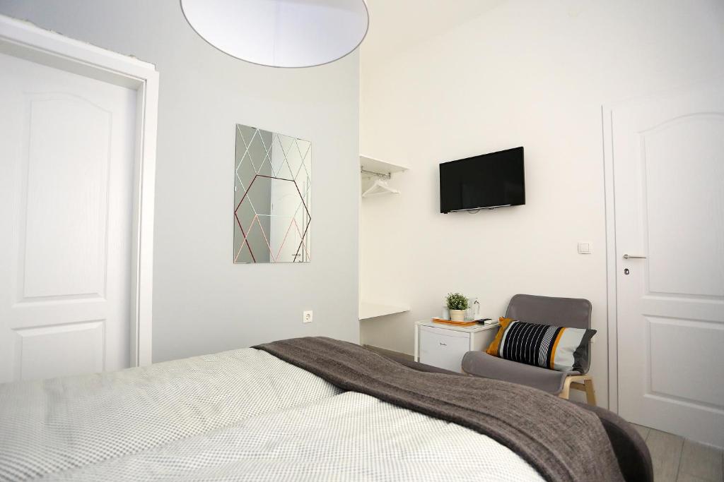 Postel nebo postele na pokoji v ubytování Guesthouse Villa Maggie