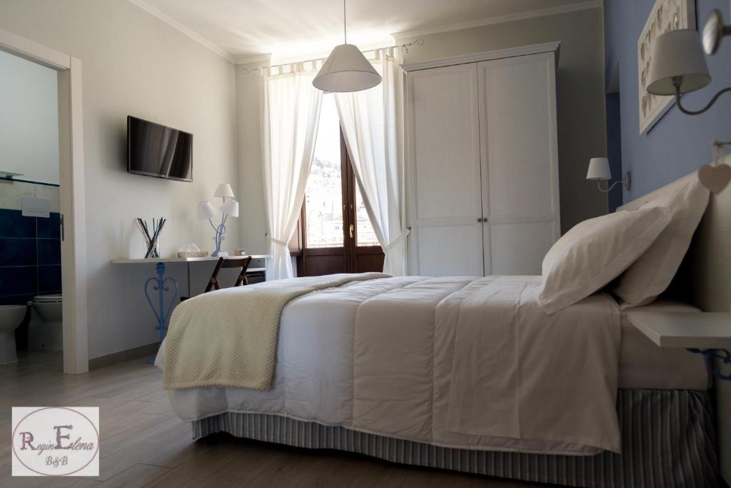 Postel nebo postele na pokoji v ubytování ReginElena B&B