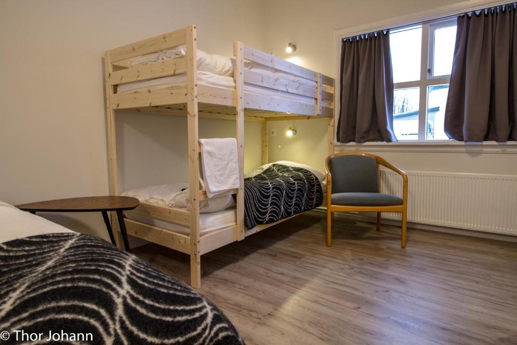 Llit o llits en una habitació de Hotel Hjardarbol