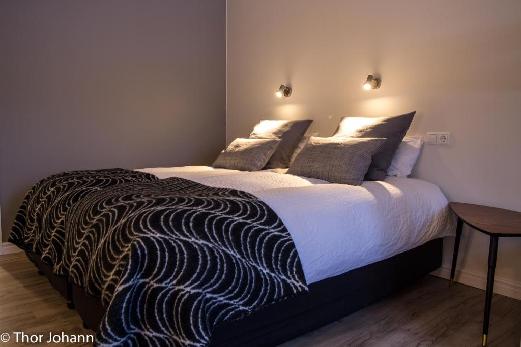 Llit o llits en una habitació de Hotel Hjardarbol