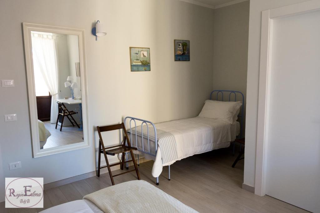 Postel nebo postele na pokoji v ubytování ReginElena B&B
