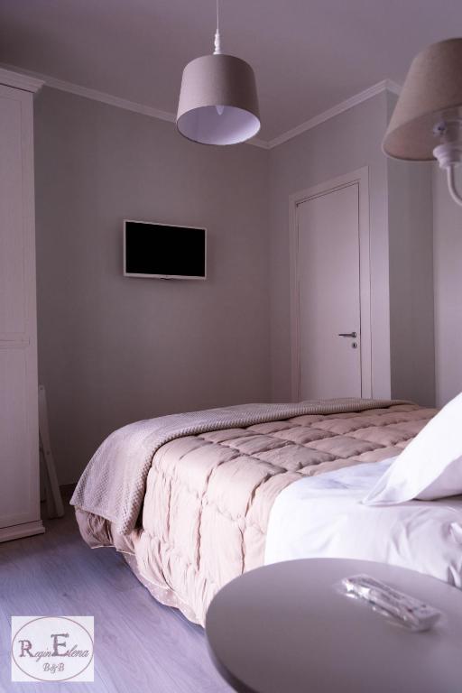 Postel nebo postele na pokoji v ubytování ReginElena B&B
