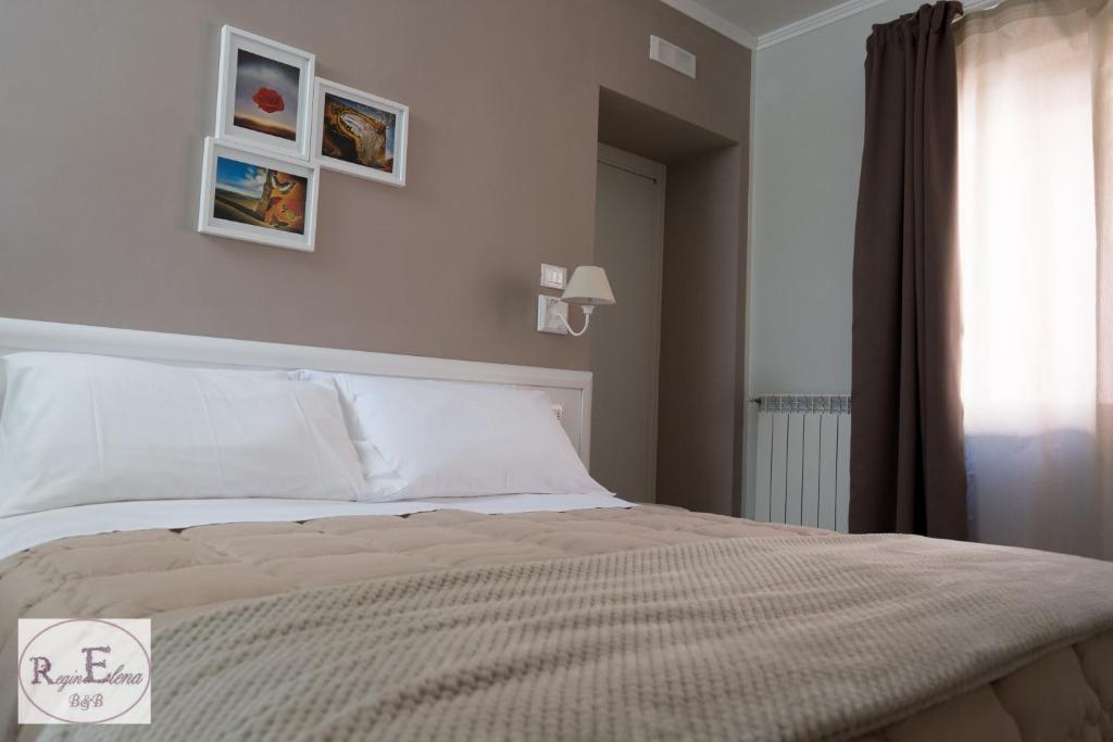Postel nebo postele na pokoji v ubytování ReginElena B&B