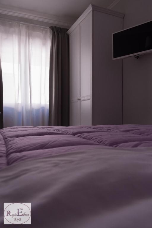 Postel nebo postele na pokoji v ubytování ReginElena B&B