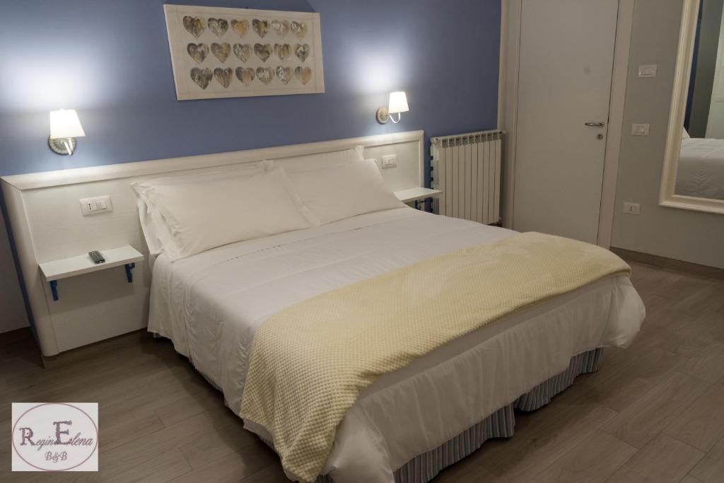 Postel nebo postele na pokoji v ubytování ReginElena B&B